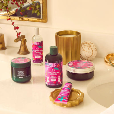 The Body Shop's Sugarplum Passion products displayed on a bathroom vanity countertop